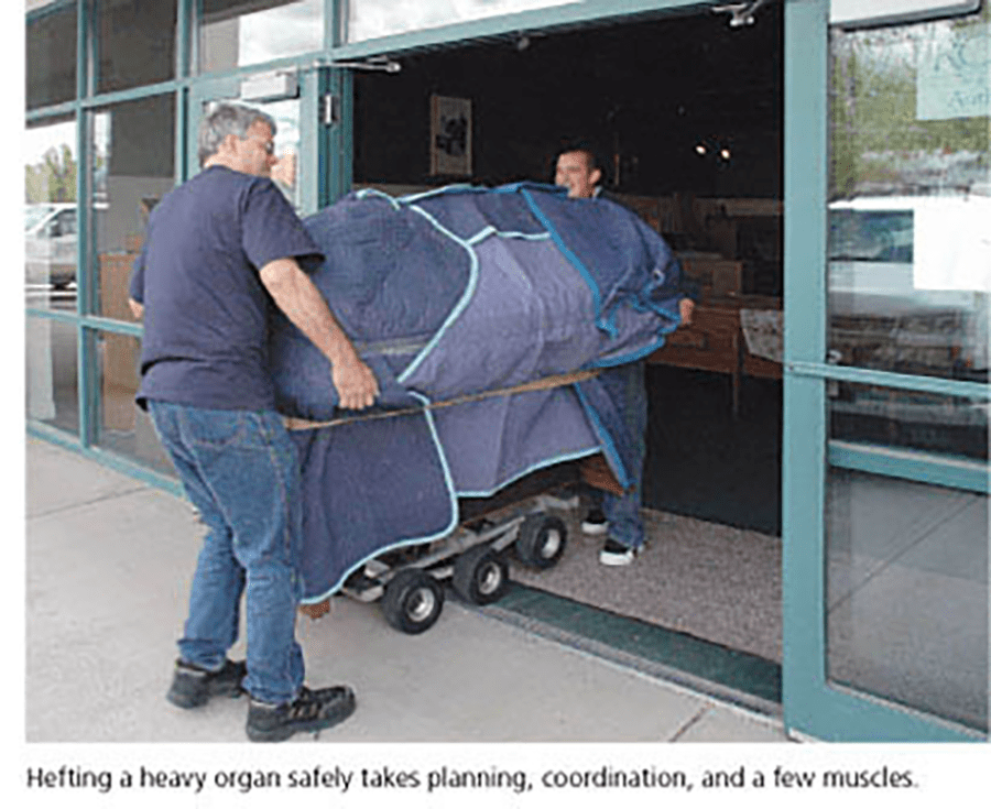Hefting a heavy organ safely takes planning, coordination, and a few muscles.