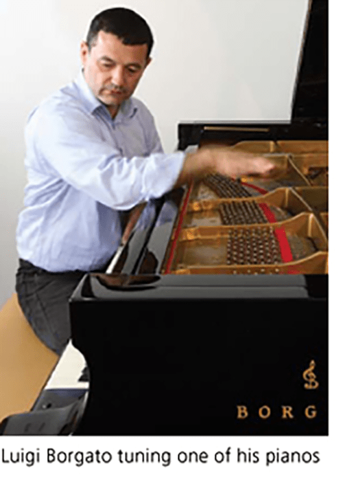 Luigi Borgato tuning one of his pianos