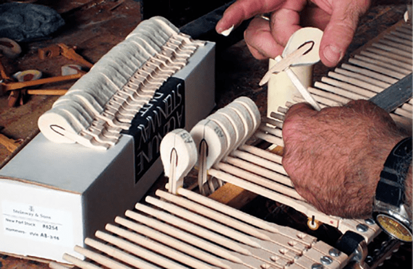 Installing new hammers on a Steinway grand. Source: A.C. Pianocraft, Inc.